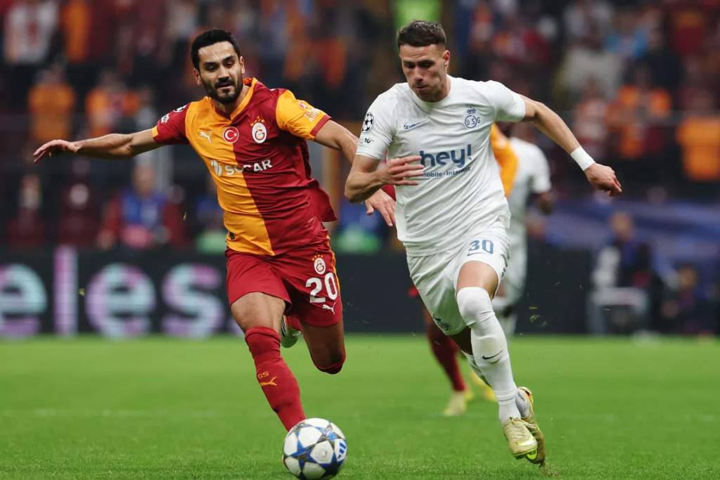 Ikay Gundogan battles it out against Raul Flourcz during the game (Photo Credit: Uefa website)