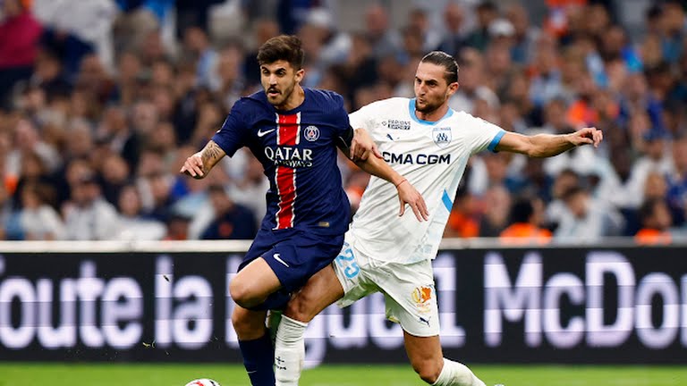 Olympique de Marseille's Adrien Rabiot in action with Paris St Germain's Lucas Beraldo - Photo Credit : REUTERS