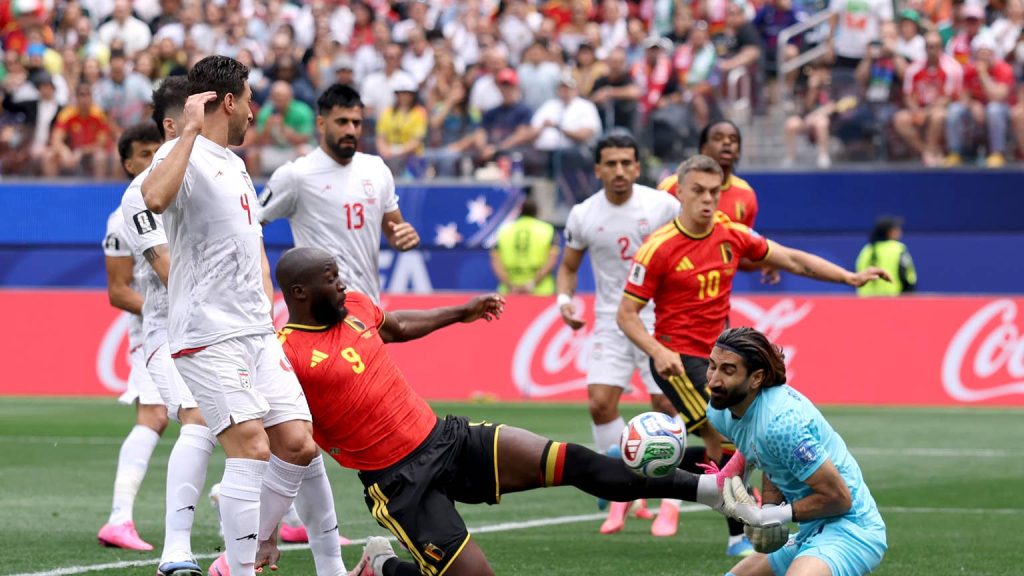 Lukaku tackle Iran goalkeeper (Photo credit: Athlon sports media)