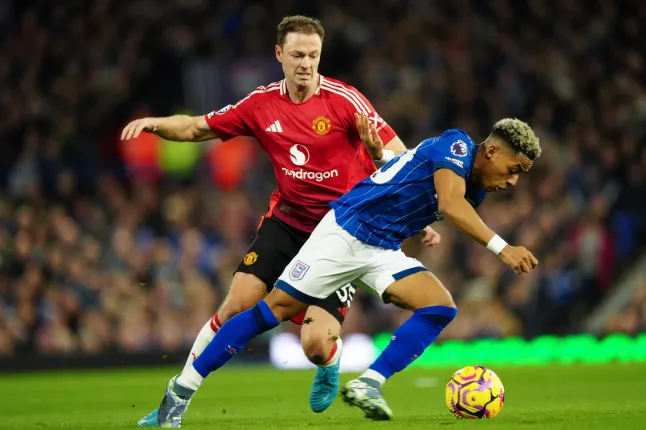 Jonny Evans and Omari Hutchinson (Photo Credit: Getty)