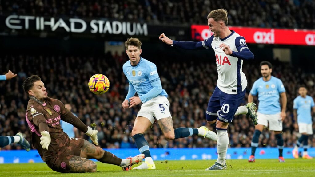 Maddison chips the ball over Ederson to make it 2 - 0 to Spurs