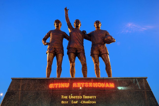 A statue of George Best, Denis Law and Bobby Charlton standing outside old Trafford (photo credit: Getty)