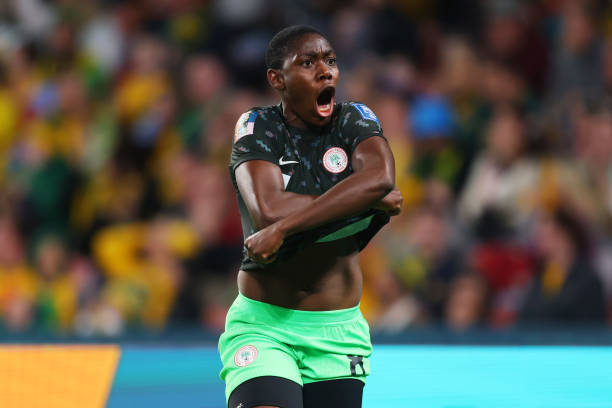BRISBANE, AUSTRALIA - JULY 27: Asisat Oshoala of Nigeria celebrates after scoring her team's third goal during the FIFA Women's World Cup Australia & New Zealand 2023 Group B match between Australia and Nigeria at Brisbane Stadium on July 27, 2023 in Brisbane, Australia. (Photo by Chris Hyde - FIFA/FIFA via Getty Images)