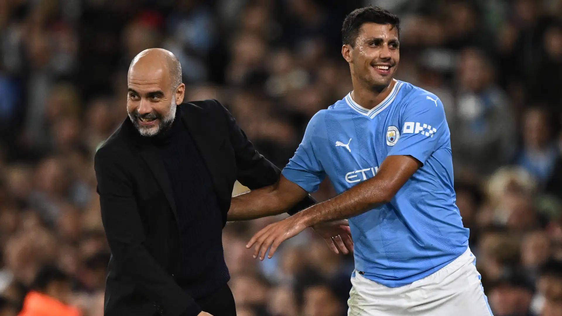 Manchester City coach Pep Guardiola and player Rodri (Photo Credit: Manchester City facebook page)