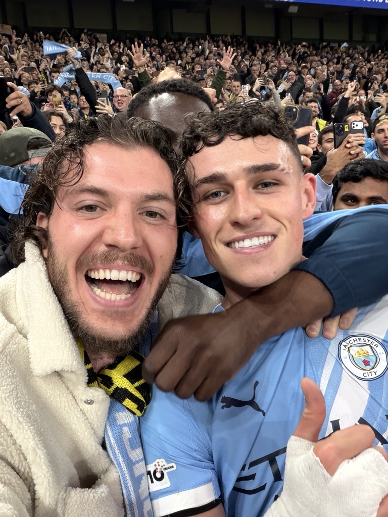 Phil Foden and a City fan vs Dortmund (Photo Credit: Manchester City via X)
