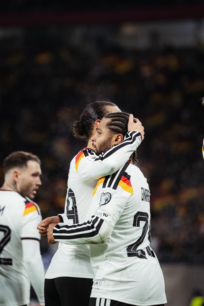 Leroy Sane and Serge Gnabry celebrate after Sane scores for Germany (Photo Credit: Germany via X)