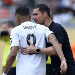 Kylian Mbappe hugs Xabi Alonso. (Photo credit: Real Madrid Media).