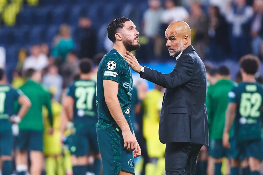Ryan Cherki and Pep Guardiola (Photo Credit: Manchester city website)