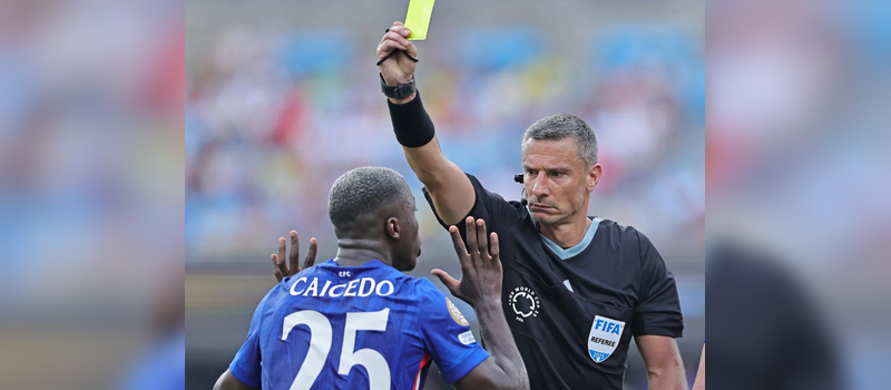 moisés caicedo receiving yellow card - Photo Credit : theguardian official Website