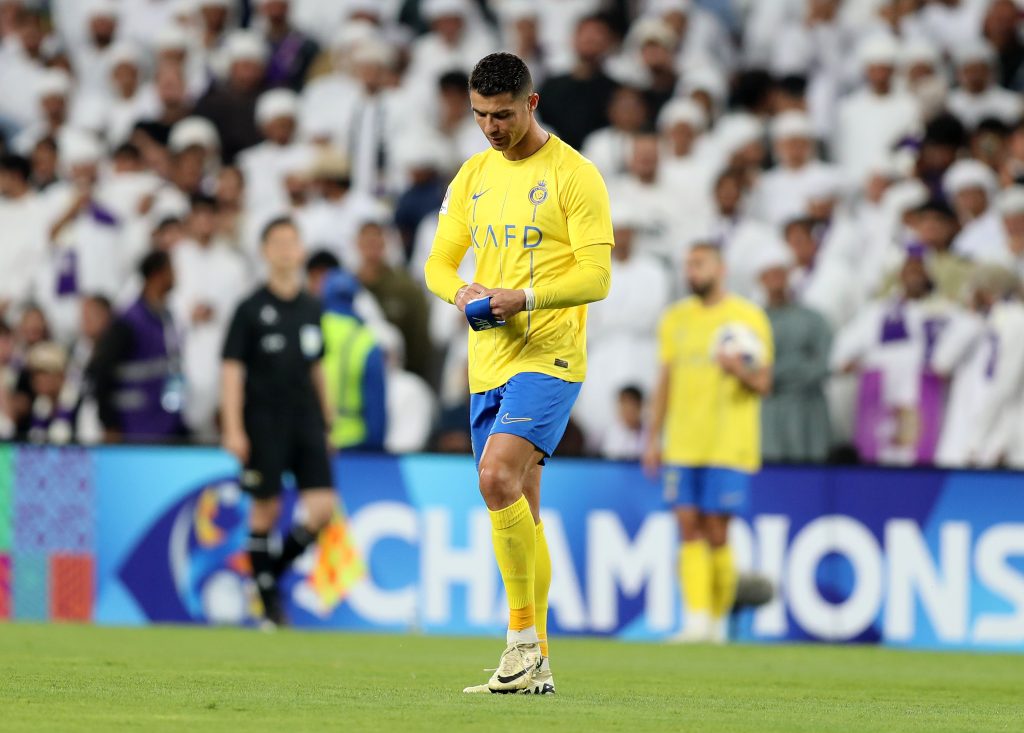 Al Nassr's Cristiano Ronaldo plays with his armband during the 1st leg of the AFC Champions League quarter-final between Al Ain and Al Nassr. Hazza Bin Zayed Stadium, Al Ain. Chris Whiteoak / The National